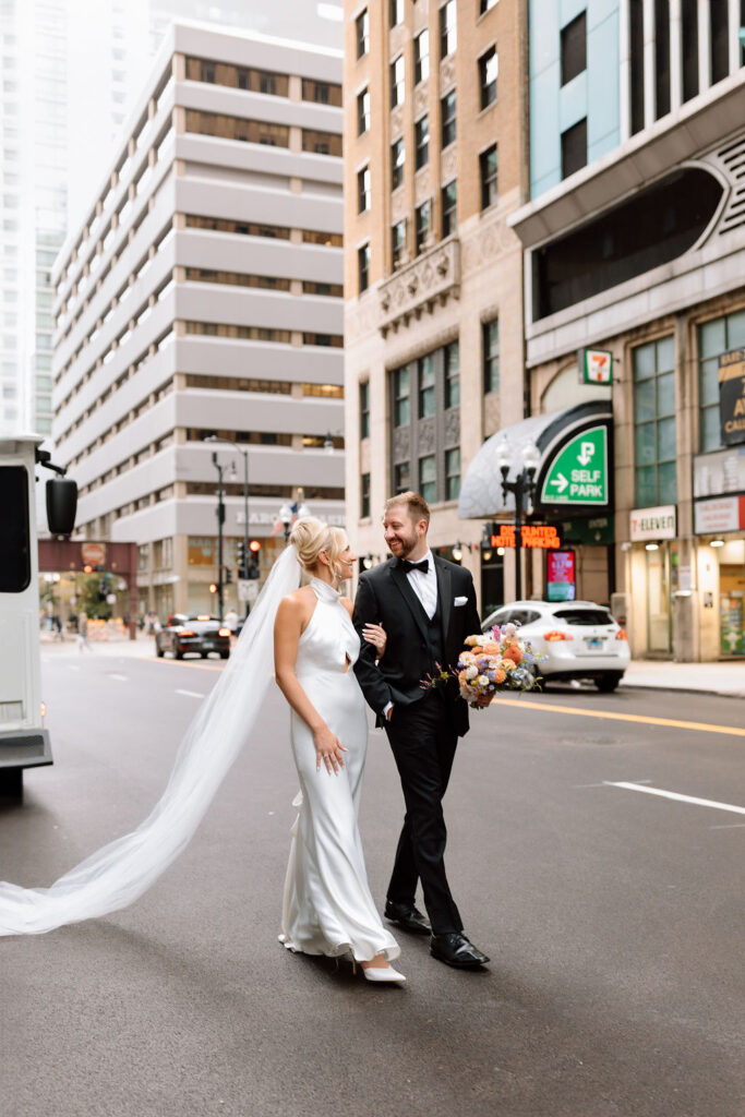 bride and groom walking in downtown chicago
